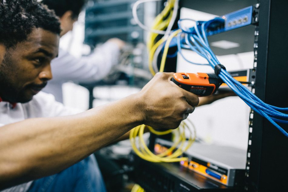 man setting up cables